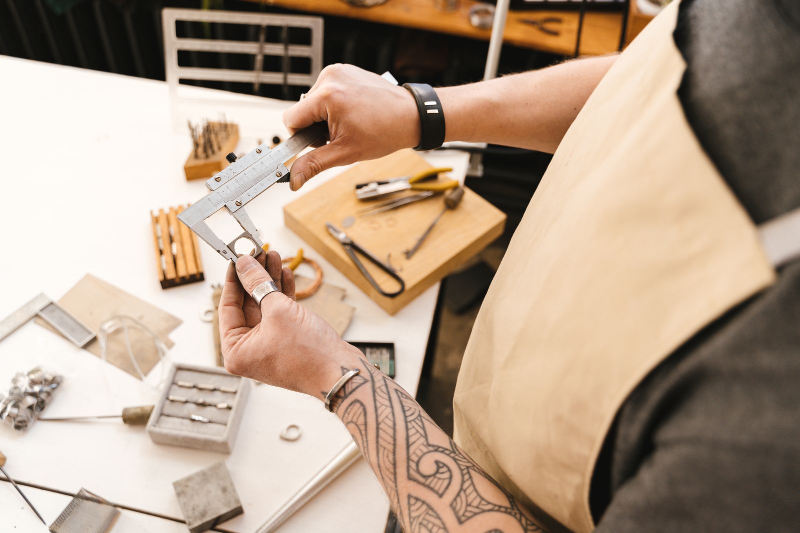 A technician using a precision measuring instrument at a maintenance bench
