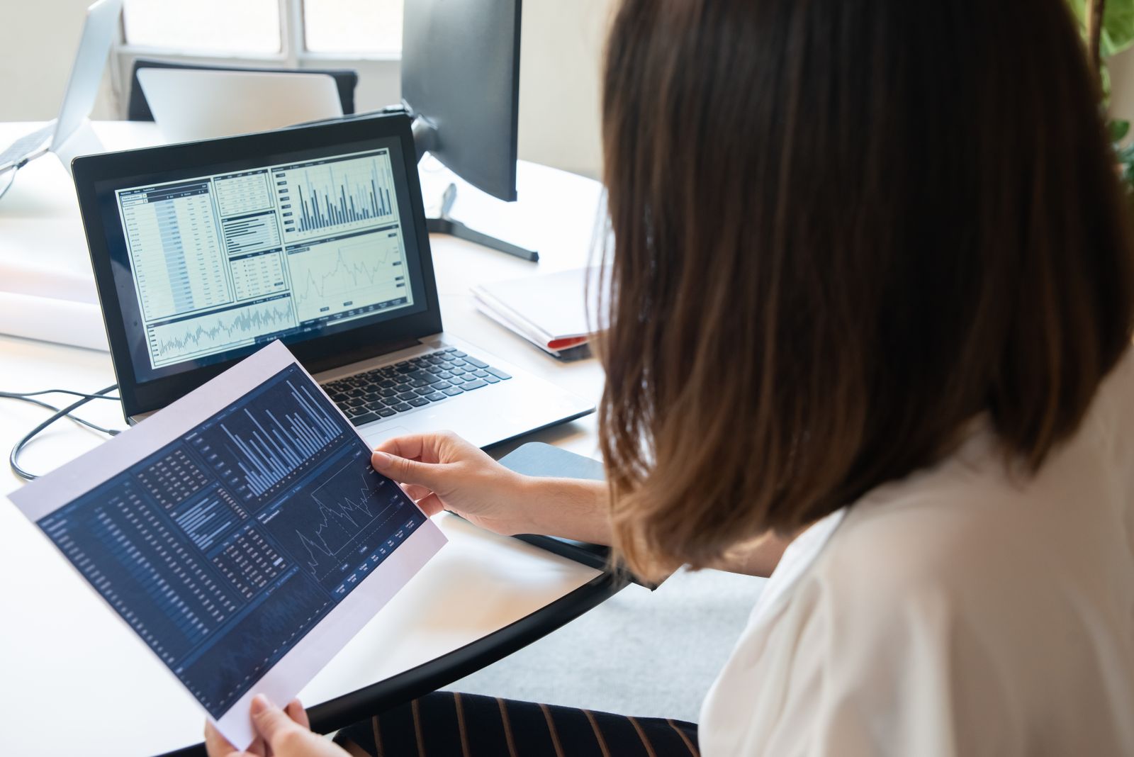 A quality professional reviewing performance metrics and dashboards