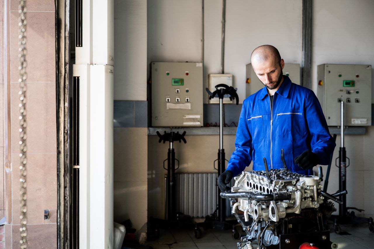 A technician evaluating a returned component to determine root cause