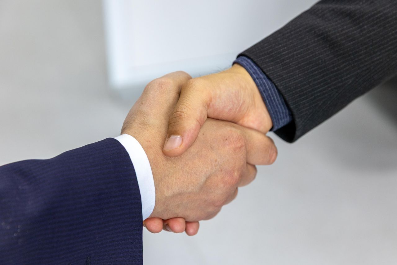 A professional handshake sealing a supplier partnership